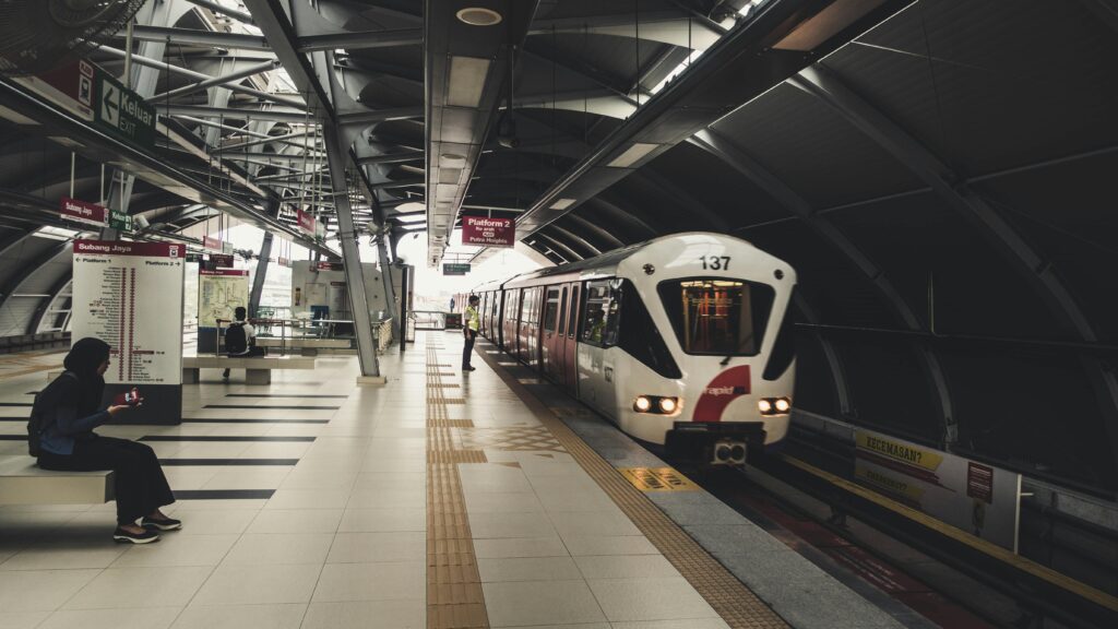 Passenger waiting for a train at a modern railway station in Kuala Lumpur, Malaysia.